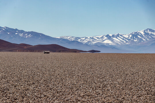Superior mirage effect at Salar de Arizaro, Salta, Argentina. Fata Morgana makes snow-capped mountains float over the arid desert salt flat landscape.