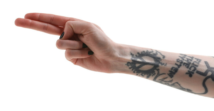 Woman with tattoos showing two fingers on white background, closeup