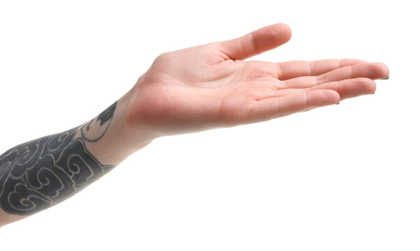 Woman with tattoos holding something on white background, closeup