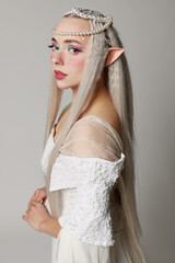 Naklejka premium Portrait of beautiful elf girl on grey background
