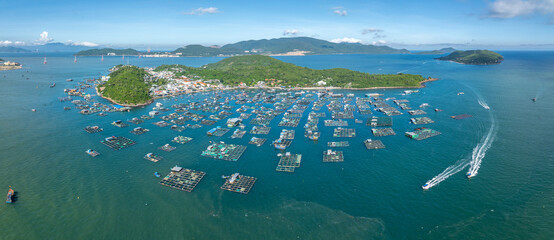 A vast array of floating fish farms in Hon Mieu, Nha Trang, Vietnam, showcases the region's aquaculture industry and its vital role in the local economy. © Zenstratus