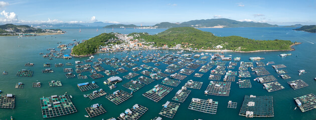 A vast array of floating fish farms in Hon Mieu, Nha Trang, Vietnam, showcases the region's aquaculture industry and its vital role in the local economy. © Zenstratus