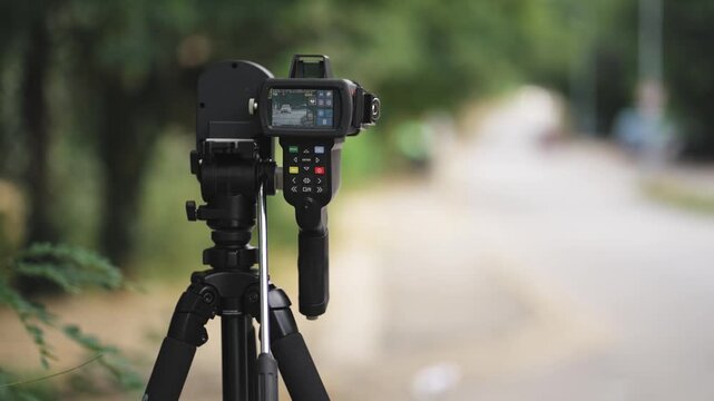 Speed control radar controlling car speed, monitoring highway traffic violations. Police traffic speed control camera