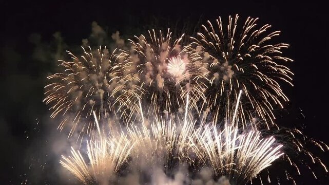 Colorful fireworks display in grand finale during evening celebration at a public event