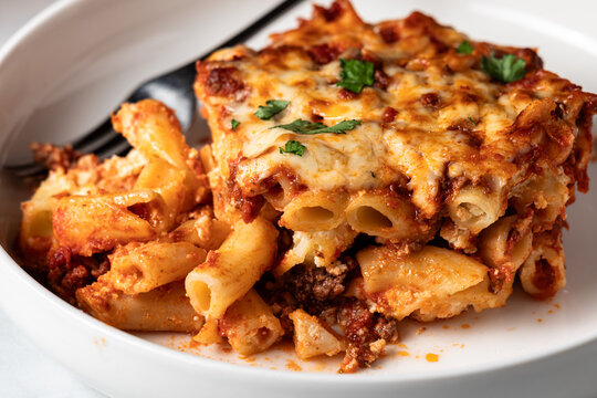 A serving of delicious homemade bake ziti, ready for eating.