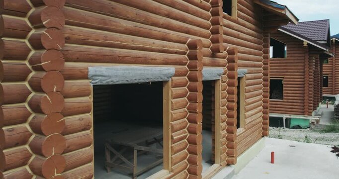 Construction industial site of houses built from wooden logs, aerial view