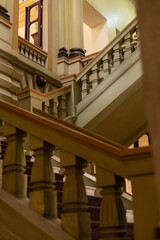 Fototapeta premium Beautiful colonial staircase featuring elegant historic architecture and classic design details in natural light.