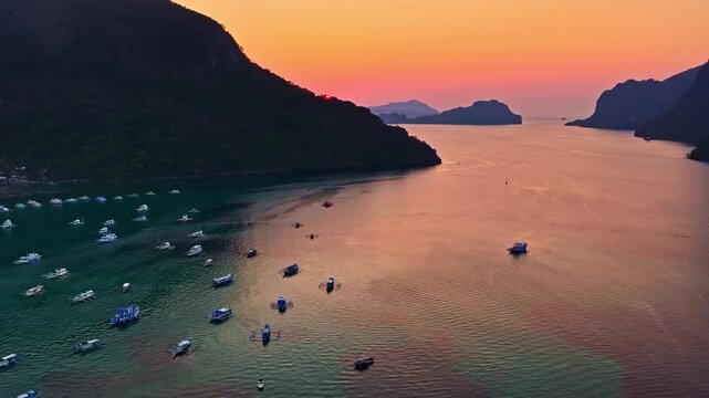 Aerial View of Boats Anchored in Calm Waters at Dusk Near El Nido, Philippines