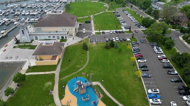 Aerial view of Bronte Harbour waterfront park and marina facilities in Oakville.mp4