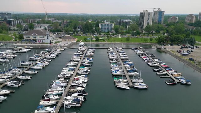 Aerial view of Bronte Harbour marina with docked boats and waterfront park in Oakville.mp4