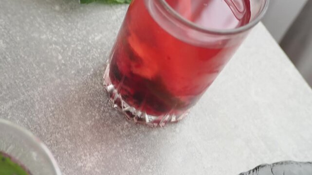 Summer drinks, colored cocktails on table. Lemonade, mojito, strawberry lemonade, tonic water. A refreshing summer drink with raspberries and blueberries, a detox drink for weight loss and keeping fit