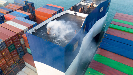 large container ship emitting thick white exhaust smoke from its funnel. Concept of maritime air pollution, environmental impact of the shipping industry, and carbon emissions from global trade. © Yellow Boat