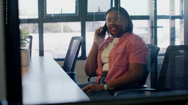 Professional woman speaking on phone in office, midcall overlay showing business data across glass