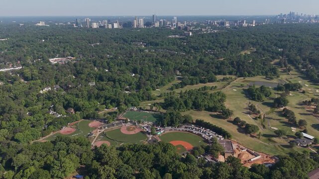 Baseball fields at Chastain Park with Atlanta skyline aerial pan