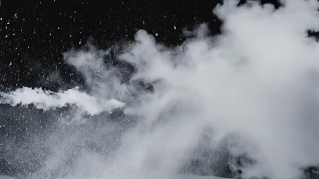 Steam and snow falling in cold wind on a dark background creates an interesting visual moment