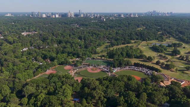 Top down aerial of baseball diamonds at Chastain Park with Atlanta skyline