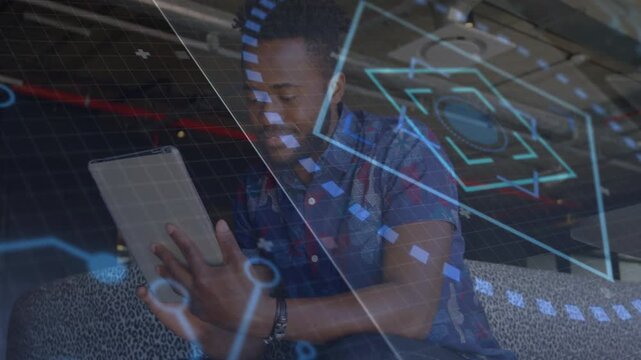 Man tapping tablet, leaning in tech lounge, blue AR overlays moving around him highlighting data