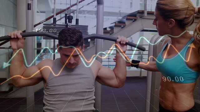 Vertical video: Man grasping lat bar for gym trainer cueing HUD waveforms or numbers syncing with re