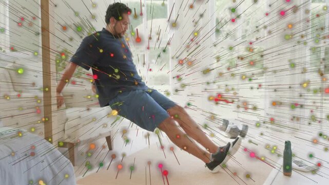 Man pressing, starting dip for home training, then sitting as radial particles overlaying scene