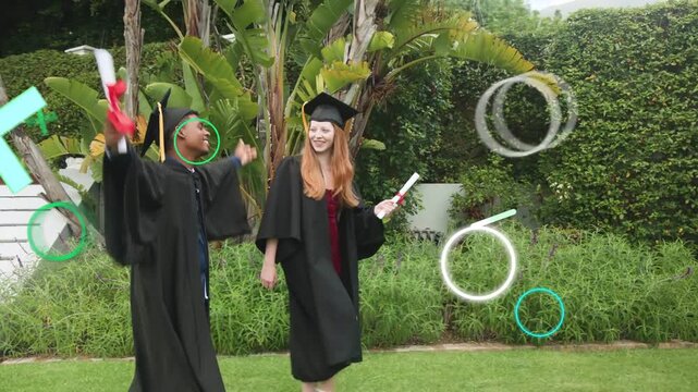 Graduation: two grads stepping on lawn with diplomas, man popping popper, overlays around them