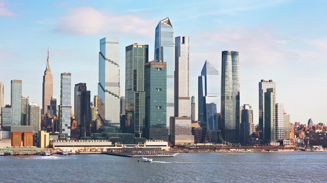Slow Hudson Yards skyscrapers panning in New York City. Hudson Yards is a neighborhood on the West Side of Midtown Manhattan in NYC.