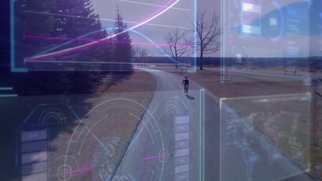 Drone tracking male cyclist pedaling for fitness toward horizon, HUD overlay showing ride charts