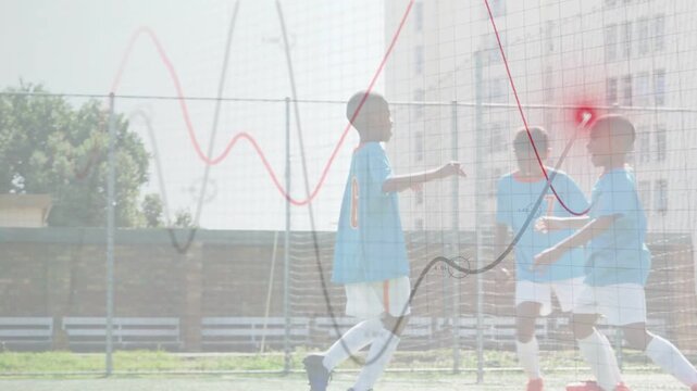 Sports team players converging celebrating after player moving to goal, red or black waves overlayin