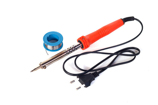 Electric soldering iron with metal tip and spool of solder wire isolated on white background. Electronic repair tools for DIY, maintenance and circuit soldering work.