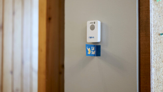 Wall Mounted Call Staff Button in a Modern Restaurant Interior