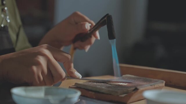 Close-up of Silversmith Soldering Silver Jewelry with Gas Blowtorch