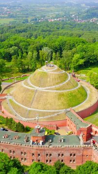 Vertical video. Krakow, Poland. Barrow Kosciuszko (Krakow). Historical monument. The construction of the mound was completed in 1823. Drone footage, Point of interest. Rich colors
