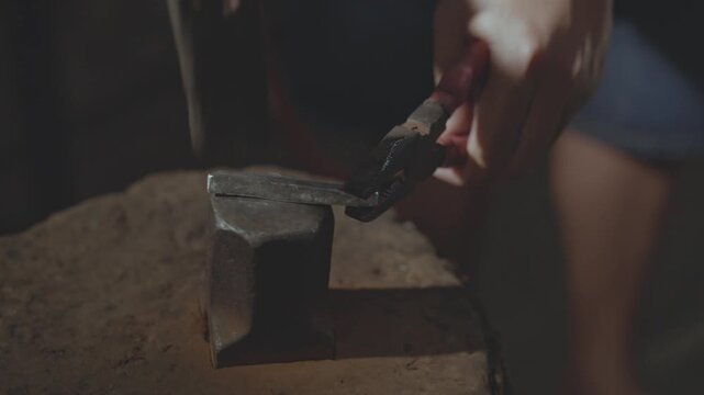 Close-up of Silversmith Forging Silver Bar in Traditional Jewelry Workshop