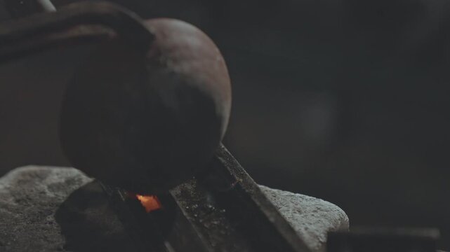 Extreme Close-up of Pouring Molten Silver into a Metal Mold