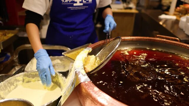 Chef Deep Frying Tempura in Large Copper Pot at Kuromon Market