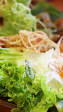 Vietnamese Nem Nuong Platter with Fresh Herbs and Grilled Pork