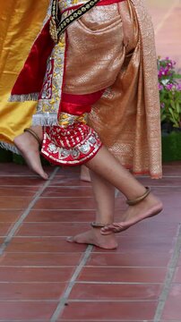 Close Up of Thai Khon Dancers Bare Feet and Traditional Costumes