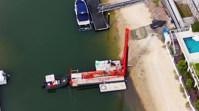 Aerial View of Piling Rig Working on Gold Coast Canal Waterfront