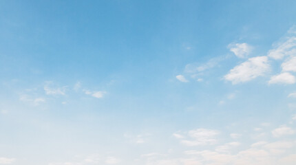 Fototapeta premium the sky is clear blue with fluffy white clouds, the sky is very bright, and the sun shines.