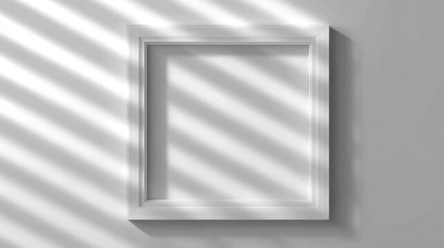 Empty square picture frame hangs on a wall illuminated by parallel light stripes
