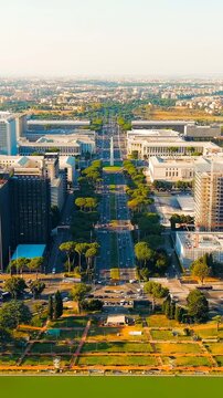 Vertical video. Rome, Italy. Piazza Guglielmo Marconi. District EUR - Quarter is a vast complex of buildings built on the orders of dictator Benito Mussolini. Drone footage. Rich colors