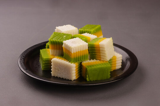 Talam labu is a traditional Southeast Asian layered dessert made from pumpkin, coconut milk, and rice flour, known for its soft and silky texture. 