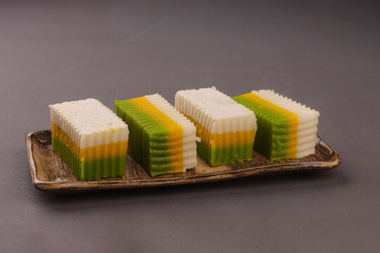 Talam labu is a traditional Southeast Asian layered dessert made from pumpkin, coconut milk, and rice flour, known for its soft and silky texture. 
