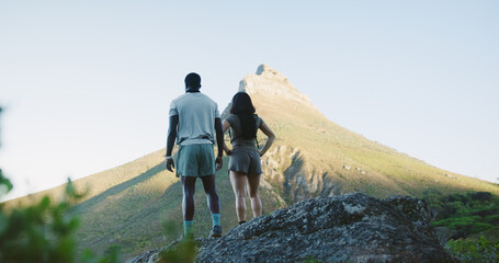 Naklejka premium Back, couple and hiking for fitness on cliff for travel, adventure and outdoor view on holiday. Space, people and trekking mountain for sightseeing, explore nature and fresh air on getaway vacation