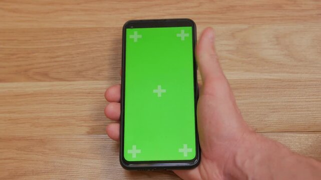 swipe scrolling gesture on chroma key of modern smartphone touch phone in green screen technology background copy space