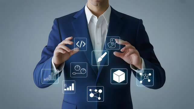 Corporate professional touching glowing holographic design icons and programming symbols in air against studio backdrop representing digital creation.