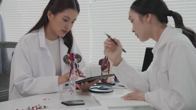 Two Asian female doctors conducted research on enlarged prostate.