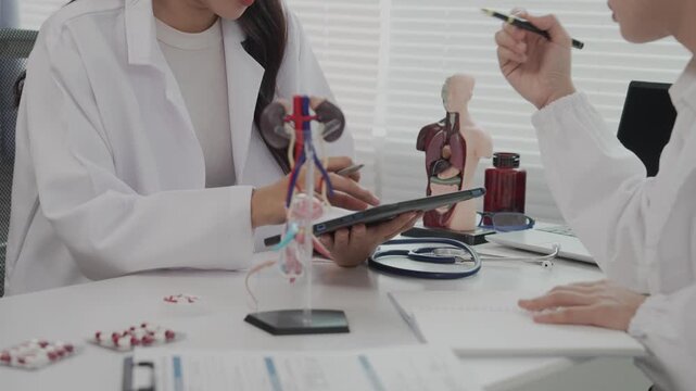 Two Asian female doctors conducted research on enlarged prostate.