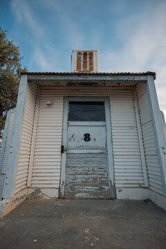 Weathered door on a corrugated metal military building