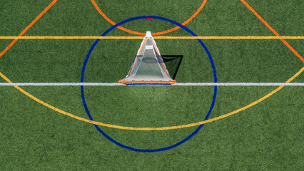 Aerial view of a multi-purpose athletic turf field featuring a lacrosse goal within a blue circular crease and overlapping colored lines for different sports.  Lacrosse, Soccer, Field Hockey, Football © Thomas