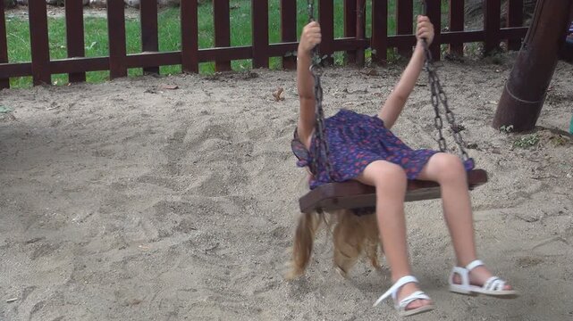 Kid Swinging Outdoor, Child Playing at Playground, Happy Smiley Girl Plays in Park, Children Outdoor